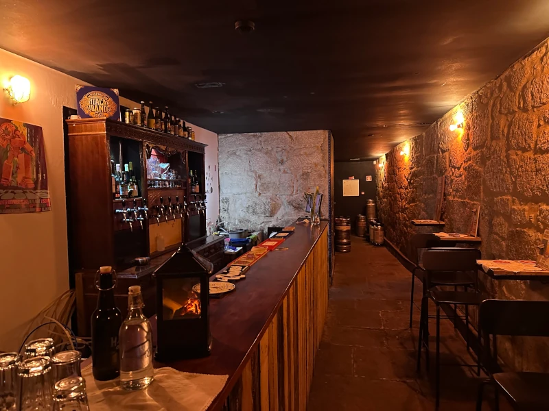 Stone-walled basement bar at Sigilo Porto