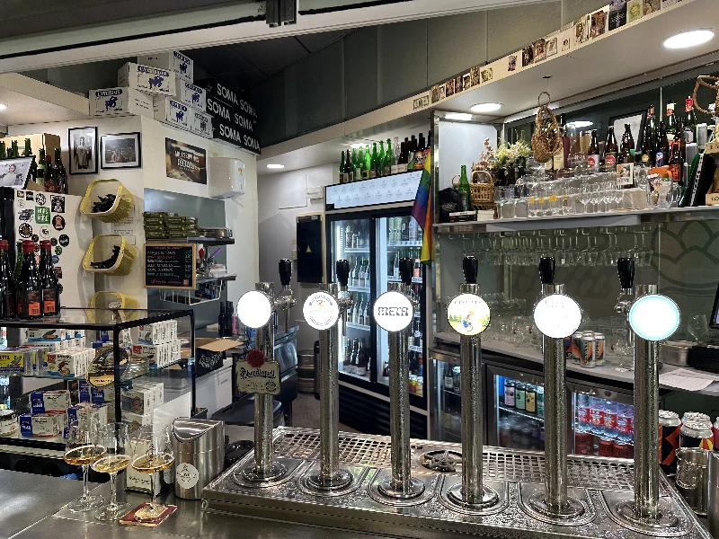 Six beer taps at La Joyeria cervecería stall, Seville